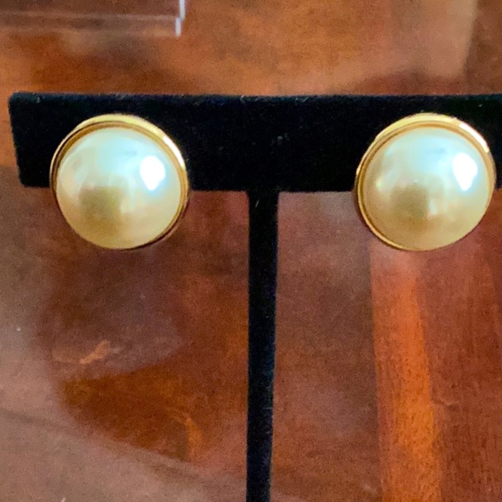 Pearl earrings with gold plated backing and closure clip on signed KJL.